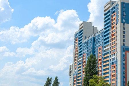 Multi-storey building against the sky with clouds. Copy space for text.