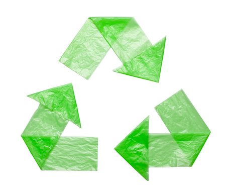 Sign recycling plastic from green bags isolated on a white background. Environmental pollution by...
