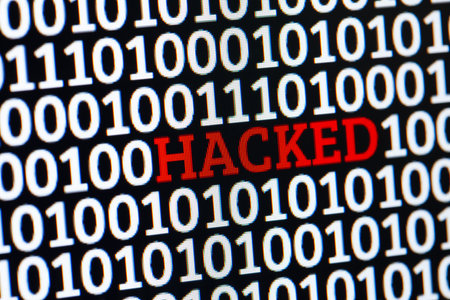 Red inscription HACKED in binary code of ones and zeros. Cyber attack electronic devices