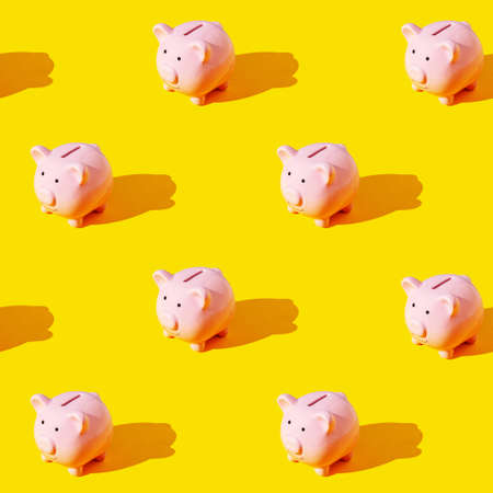 Seamless texture pattern. Piggy bank on a yellow background. Set. Long harsh shadow from the summer sunshineの写真素材