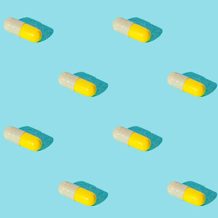 Seamless texture pattern. Pills in capsule on a green background. Set. Long harsh shadow from the summer sunshineの写真素材