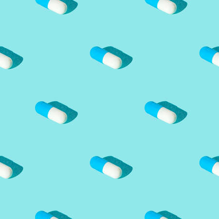 Seamless texture pattern. Pills in capsule on a green background. Set. Long harsh shadow from the summer sunshineの写真素材
