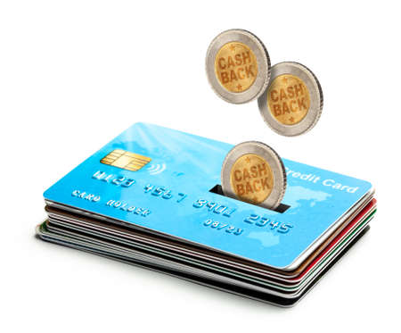 Coins Cashback falls into a credit card. Refund. Bonus payments after the purchase. Isolated on a white backgroundの写真素材