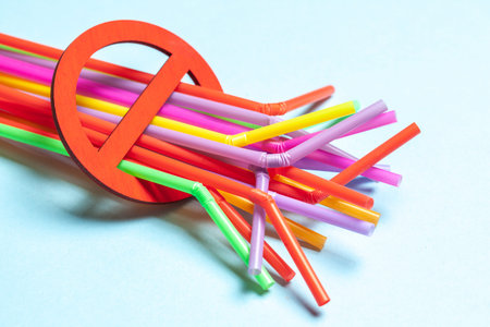 Ban on plastic straws for drinks. Prohibition sign and plastic