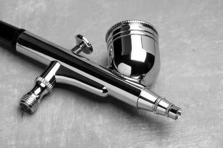 Airbrush on a gray table.の写真素材