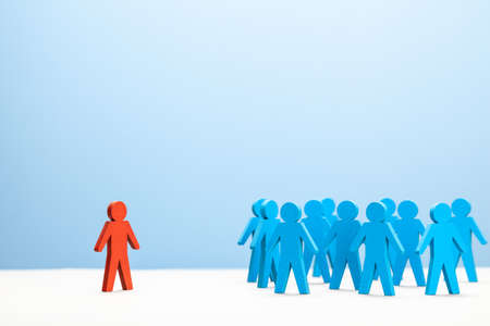 One leader is red and a crowd of staff. Discrimination and infringement of work rightsの写真素材