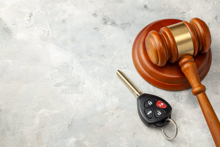 Car accident. Judge gavel and car bleeding with alarm. Car Insurance Solutionの写真素材
