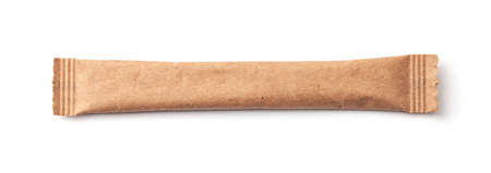 Sugar stick. Sugar in paper kraft packaging. Mock up for designの写真素材