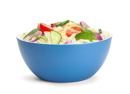 Vegetarian salad with vegetables in plate isolated on white backgroundの写真素材