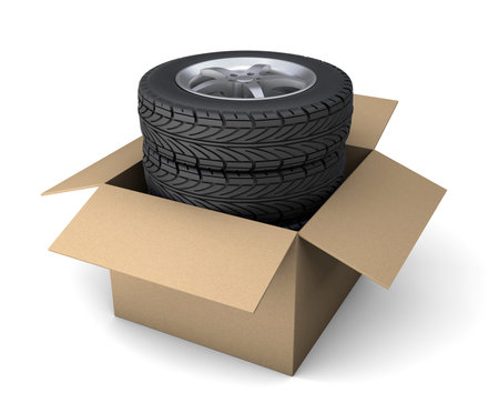 Set of four tires with disks in a cardboard box for order delivery. isolated on white background. 3d renderの写真素材