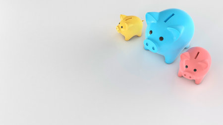 Different colored piggy banks, small and large. Copy space for text. 3d renderの写真素材