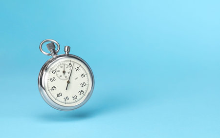 Stopwatch in levitation on blue background. Template Copy space for textの写真素材
