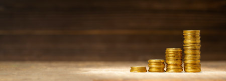 Stack of coins, steps upward, as a symbol of success. The concept is a good investment or profit....