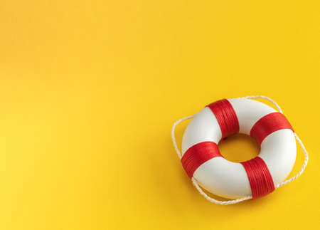 Lifebuoy on a yellow background. Template Copy space for textの写真素材