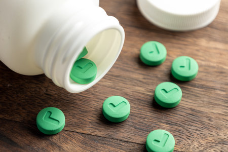 Effective tablet. Green pills with a white bottle.の写真素材