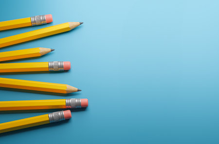 Yellow pencils on a blue background. Template Copy space for text. mockup. 3d renderの写真素材