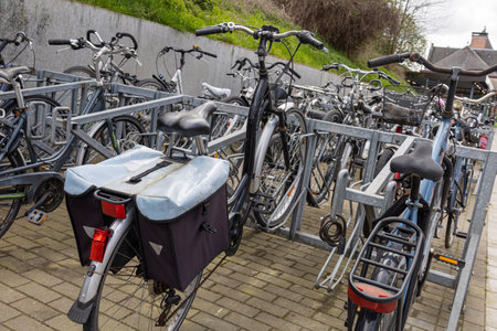 Bicycle parking on the street. Lots of packed bikes.の写真素材