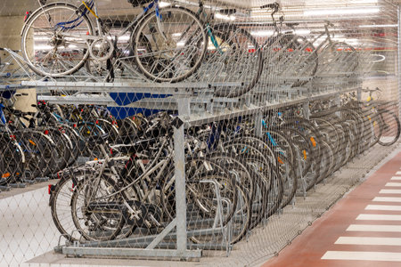 Bicycle parking. Bicycles behind the net and under security.の写真素材