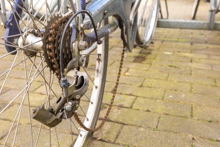 Broken bicycle with a rusty chain.の写真素材