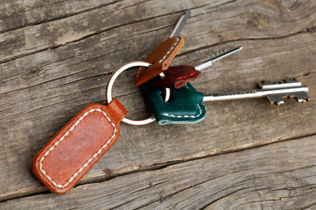 Bunch of keys with a leather strap.の写真素材