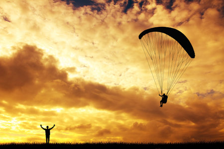 Paraglider at sunset