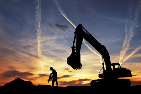 Bulldozer silhouette at sunsetの写真素材