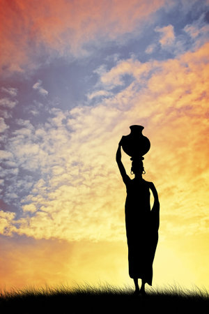 African woman carrying waterの写真素材