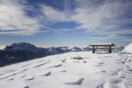 Bench in winter landscapeの写真素材