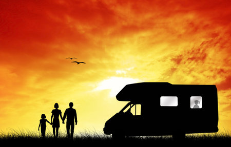 Family camping with caravanの写真素材