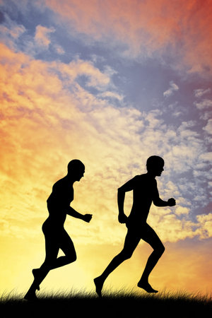 men running at sunsetの写真素材