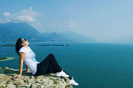 Girl on the rockの写真素材