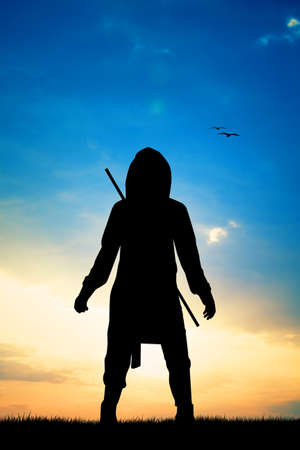 ninja silhouette at sunsetの写真素材