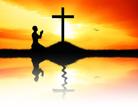 man prays at sunsetの写真素材