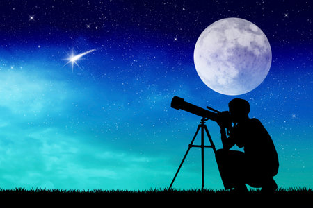 Man looks into the telescopeの写真素材