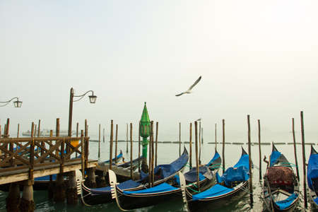 Gondolas in the fog in Venice, Italyの写真素材
