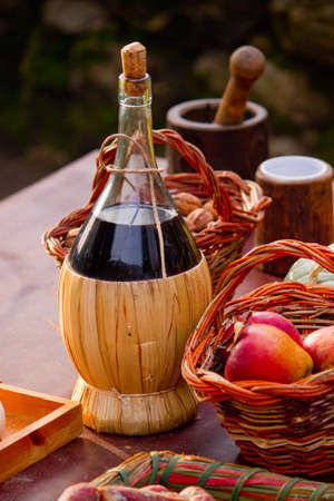 bottle of red wine and fruitの写真素材