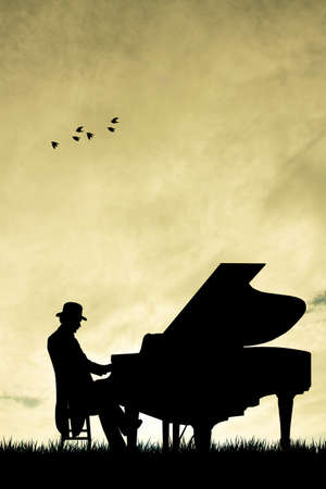 Pianist silhouette at sunsetの写真素材