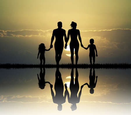 Happy family at sunsetの写真素材