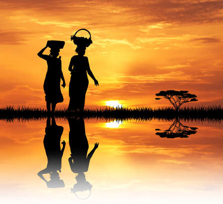 African women at sunsetの写真素材