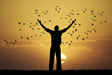 man looks flock of birdsの写真素材