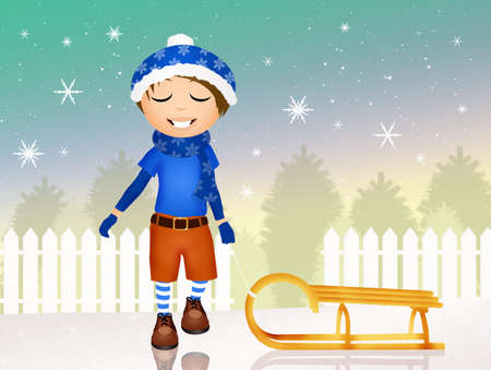 child with sleigh in winterの写真素材