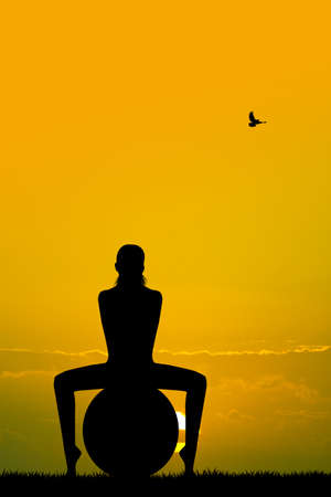 Pilates silhouette at sunsetの写真素材