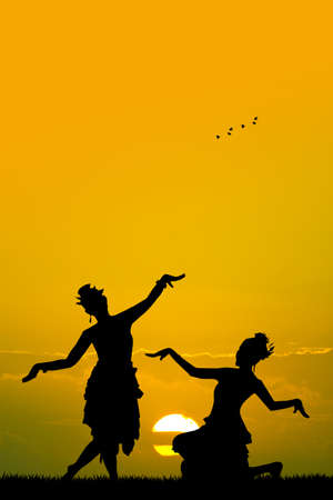 Indonesian dance at sunsetの写真素材