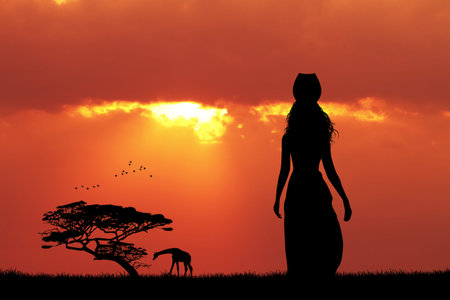 African woman at sunsetの写真素材
