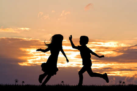 happy children at sunsetの写真素材