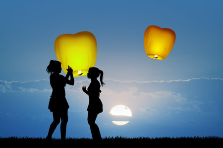 children with flying lanternsの写真素材