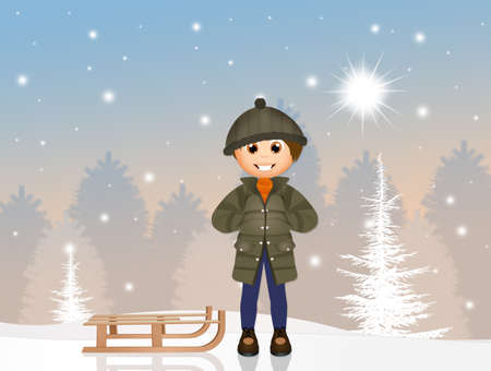 child with sleigh in the snowの写真素材