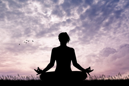 girl doing yoga at sunsetの写真素材