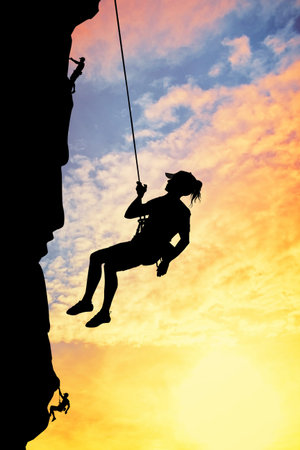 free climber at sunset