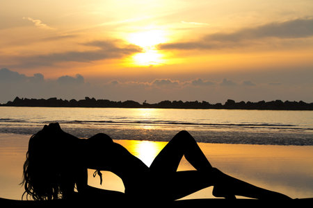 Woman lying in the sunの写真素材